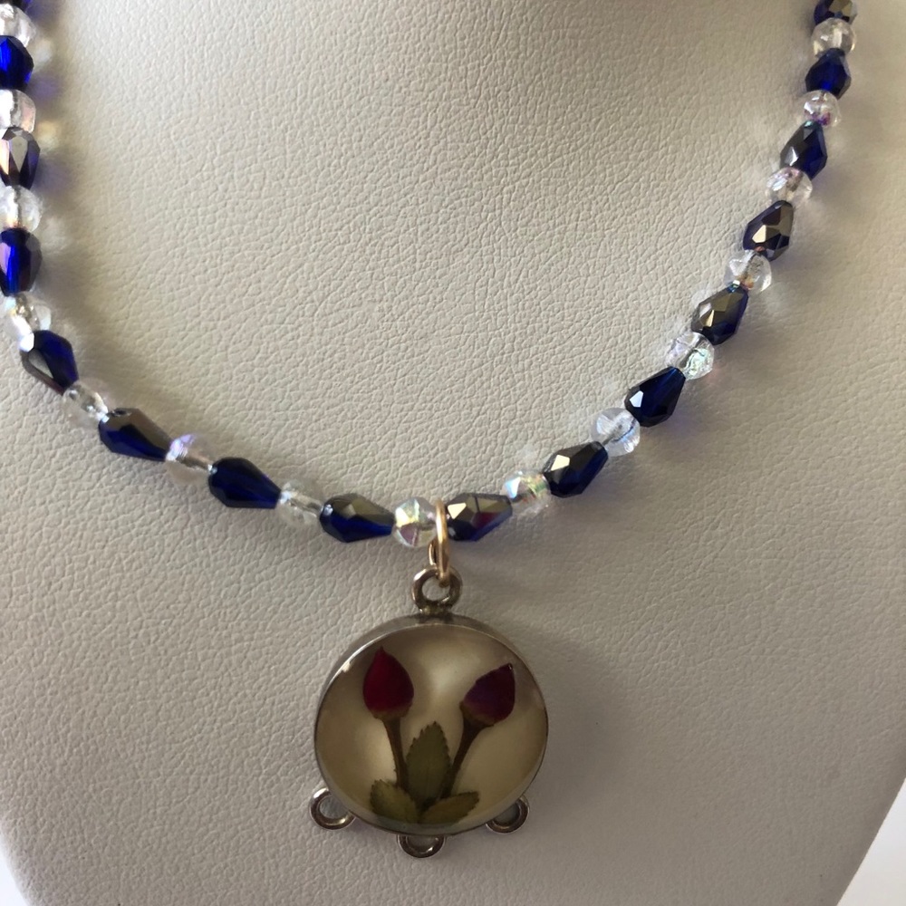 Sterling silver bud charm on 22” beaded necklace